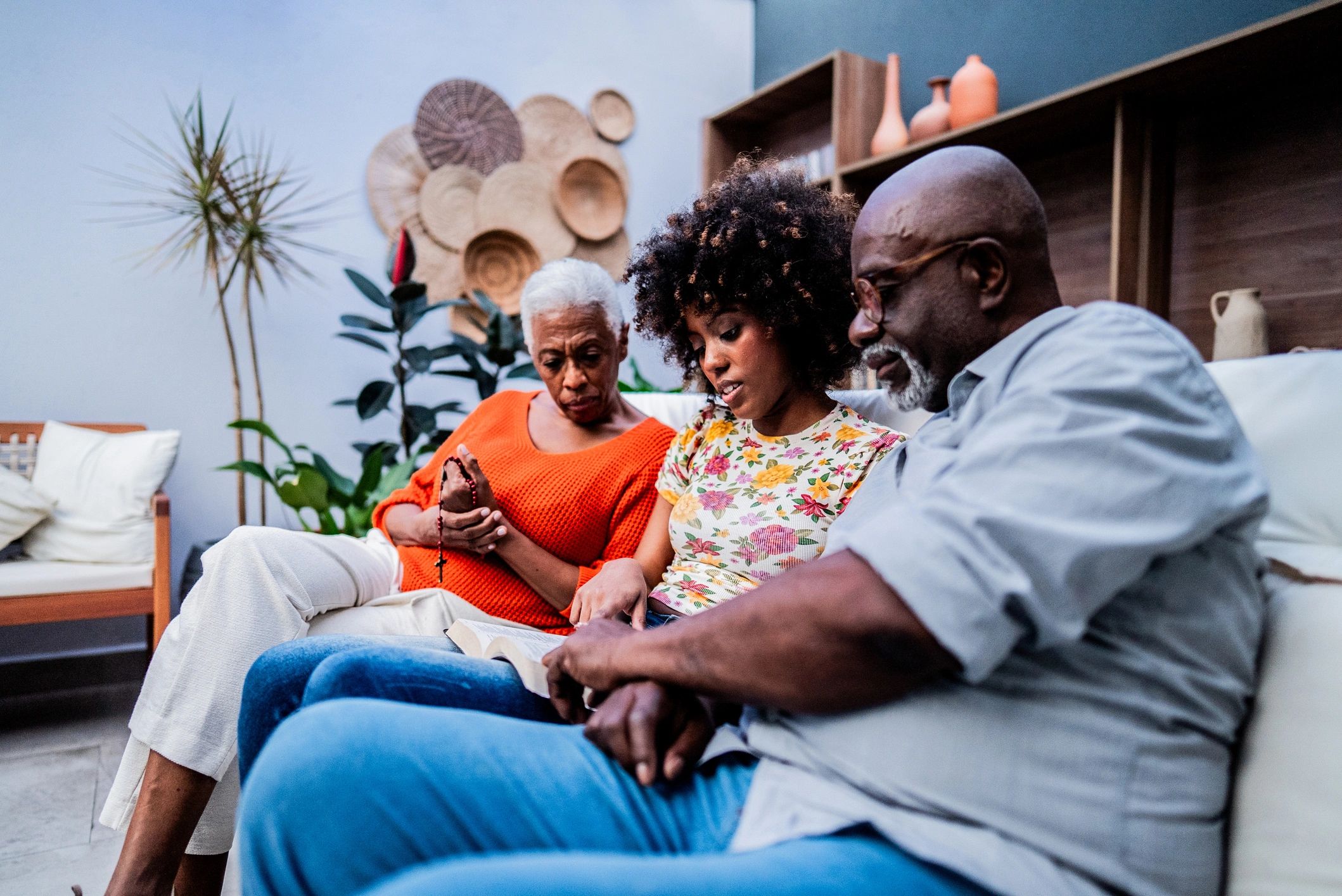 Family reading the Bible and praying together