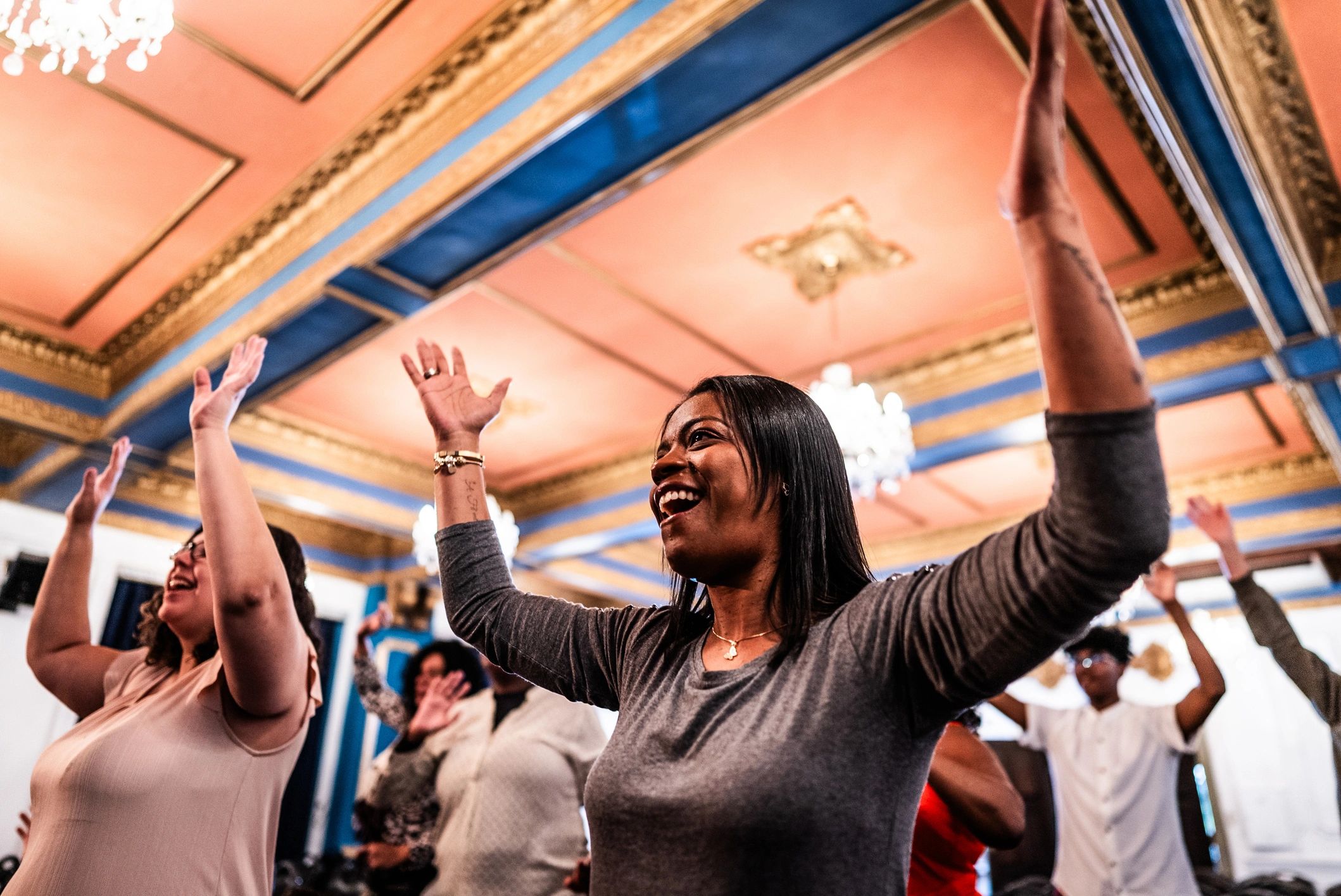 Woman raising hands in worship celebration